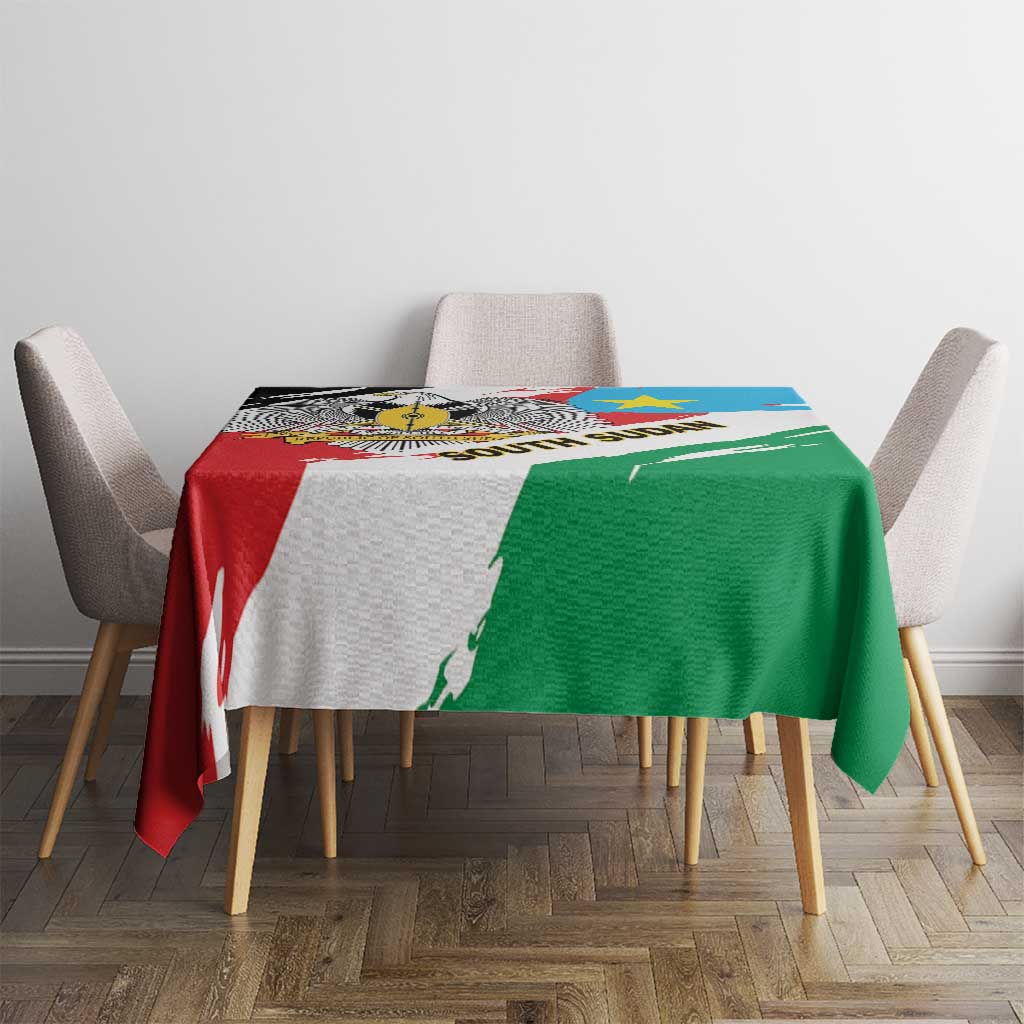 South Sudan flag grunge tablecloth on dining table, red and green sections with blue stripe