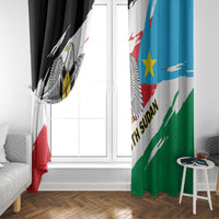 South Sudan flag-style curtain pair by window, black panel and green/blue panel with emblem