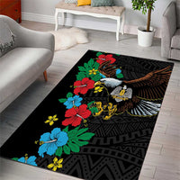 Black area rug with colorful hibiscus flowers and spread-wing bird over geometric motifs