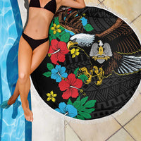 Round black beach blanket with white fringe, hibiscus floral pattern and eagle emblem