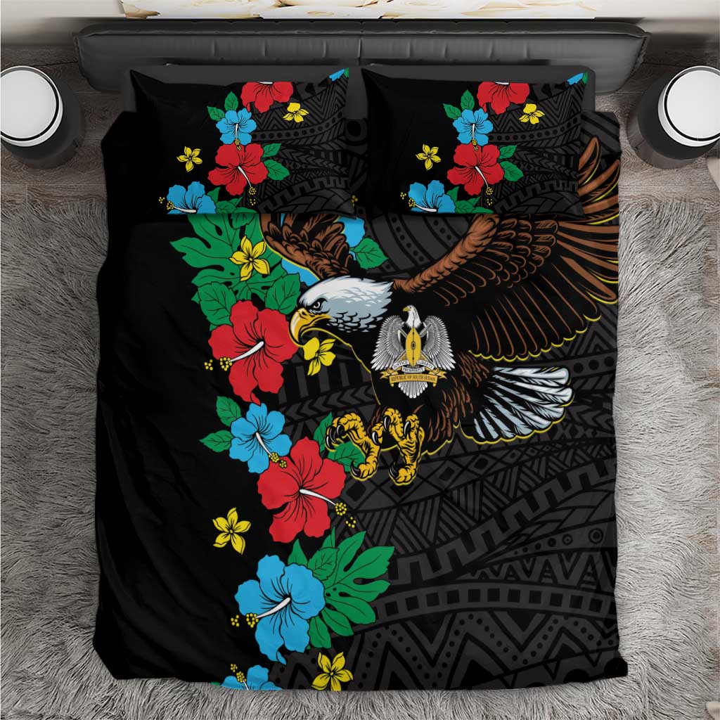 Black duvet and two pillowcases featuring hibiscus flowers and an eagle motif
