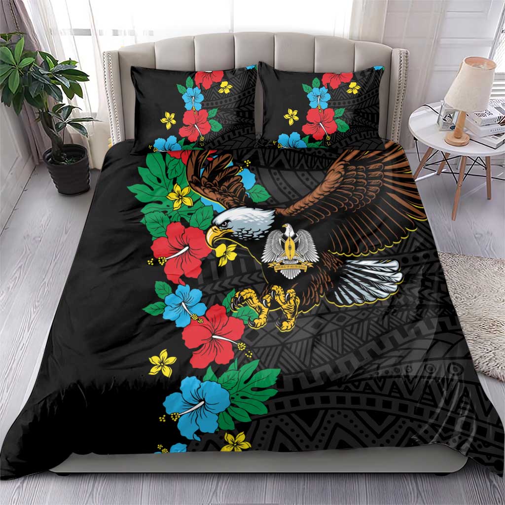 Black bedding set with hibiscus floral accents and eagle artwork on duvet and pillows
