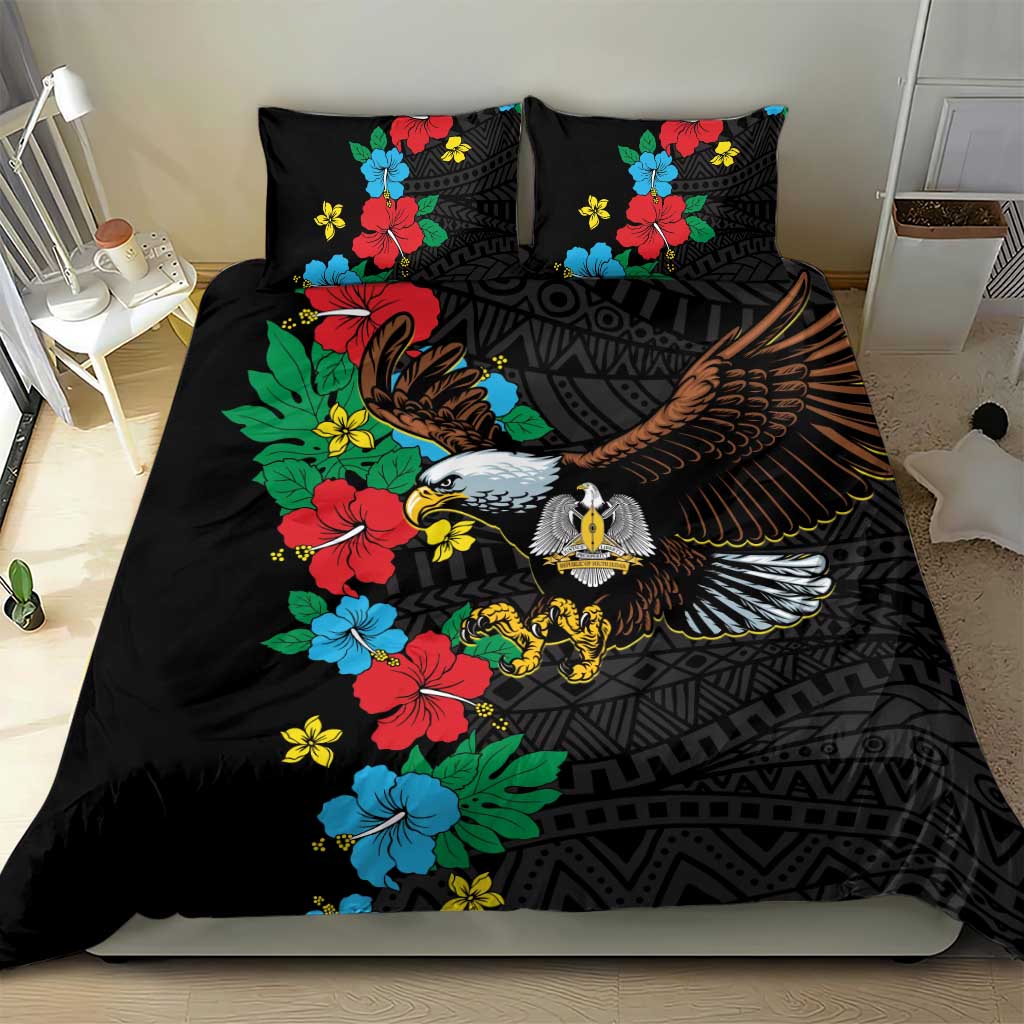 Black duvet cover with hibiscus florals and eagle graphic, shown with two pillowcases