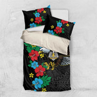Black duvet cover and two matching pillowcases with hibiscus florals and eagle print