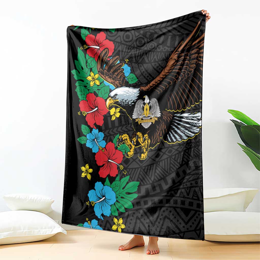 Black throw blanket hanging with eagle and hibiscus floral, African pattern