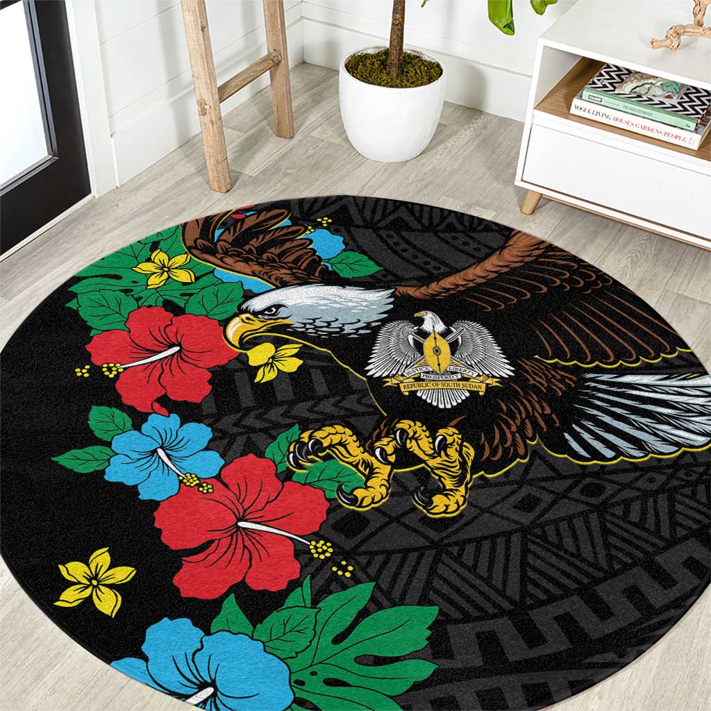 Black round rug with hibiscus floral, bird and lion motifs, African pattern