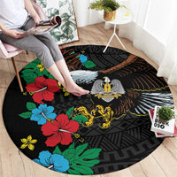 Black round rug with hibiscus floral and bird/lion center graphic, African pattern