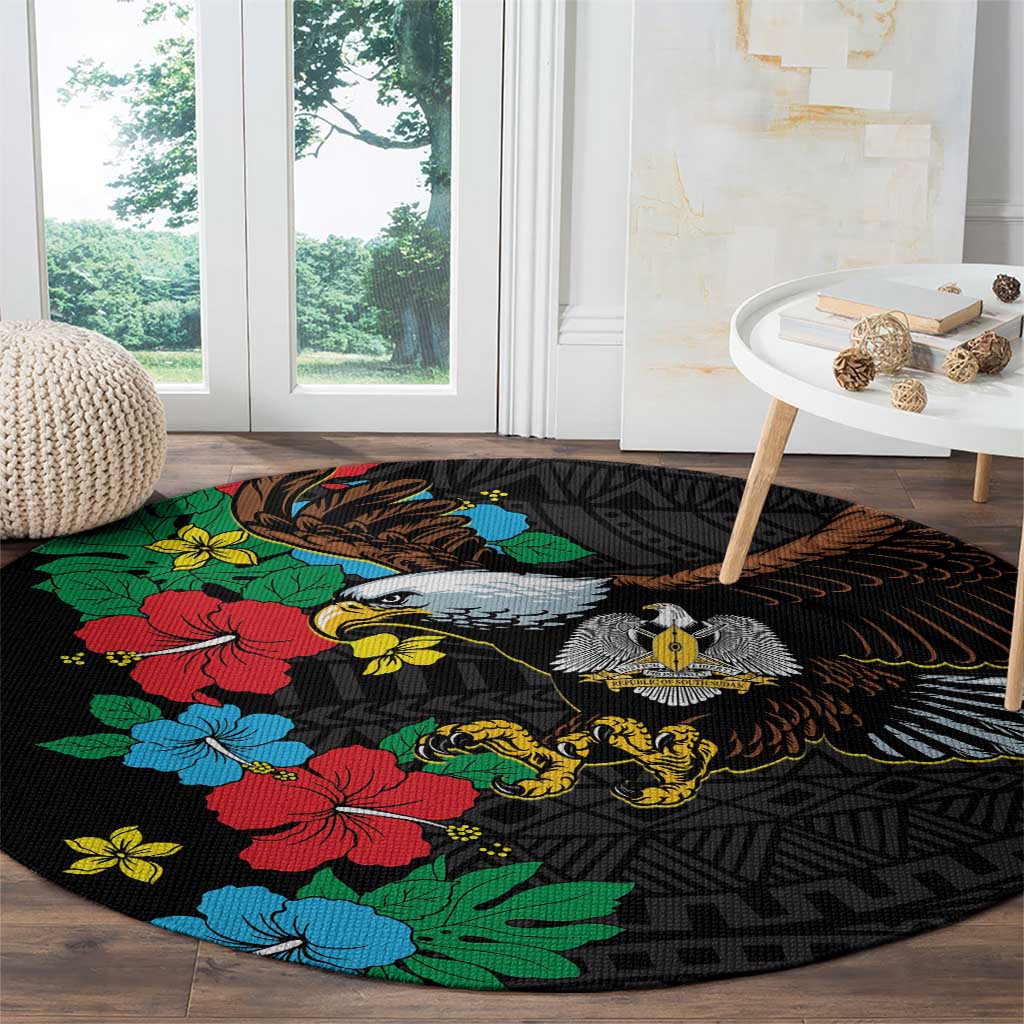 Black round rug with hibiscus floral, bird head and wings, African pattern