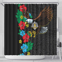 Black shower curtain with hibiscus floral and eagle wing motif, hanging view