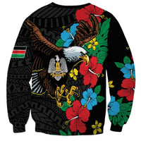 Black unisex sweatshirt featuring eagle bird graphic and vivid hibiscus flowers on sleeves