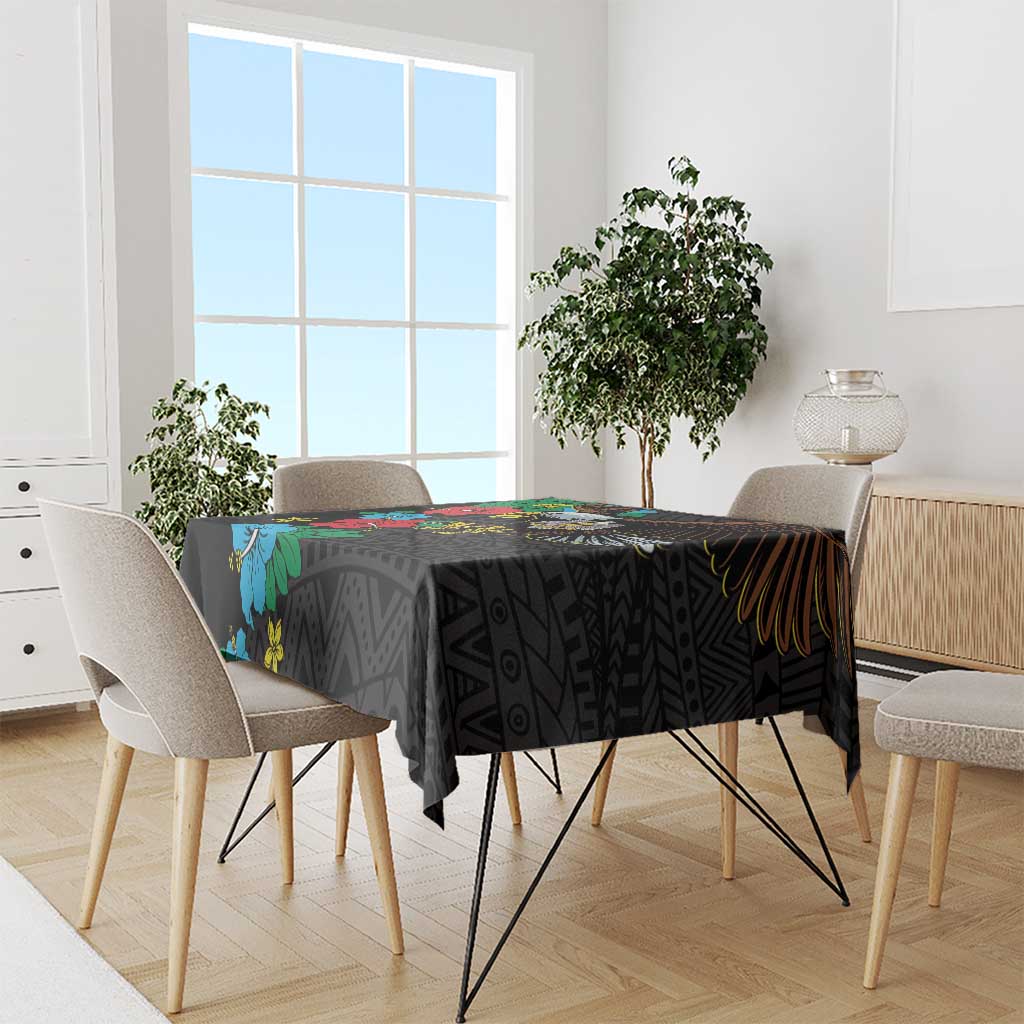 Black tablecloth with colorful hibiscus flowers and geometric motifs across table