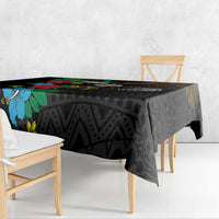 Black tablecloth with hibiscus floral panel and dark geometric weave pattern