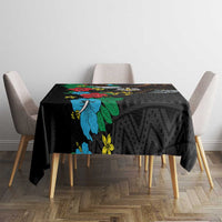 Black tablecloth with bold blue hibiscus flowers and geometric texture pattern