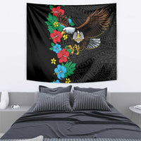 Black tapestry featuring eagle in flight with colorful hibiscus flowers