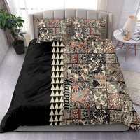 Quilt bedding set with black quilt, beige and red tropical patchwork center, and zigzag border