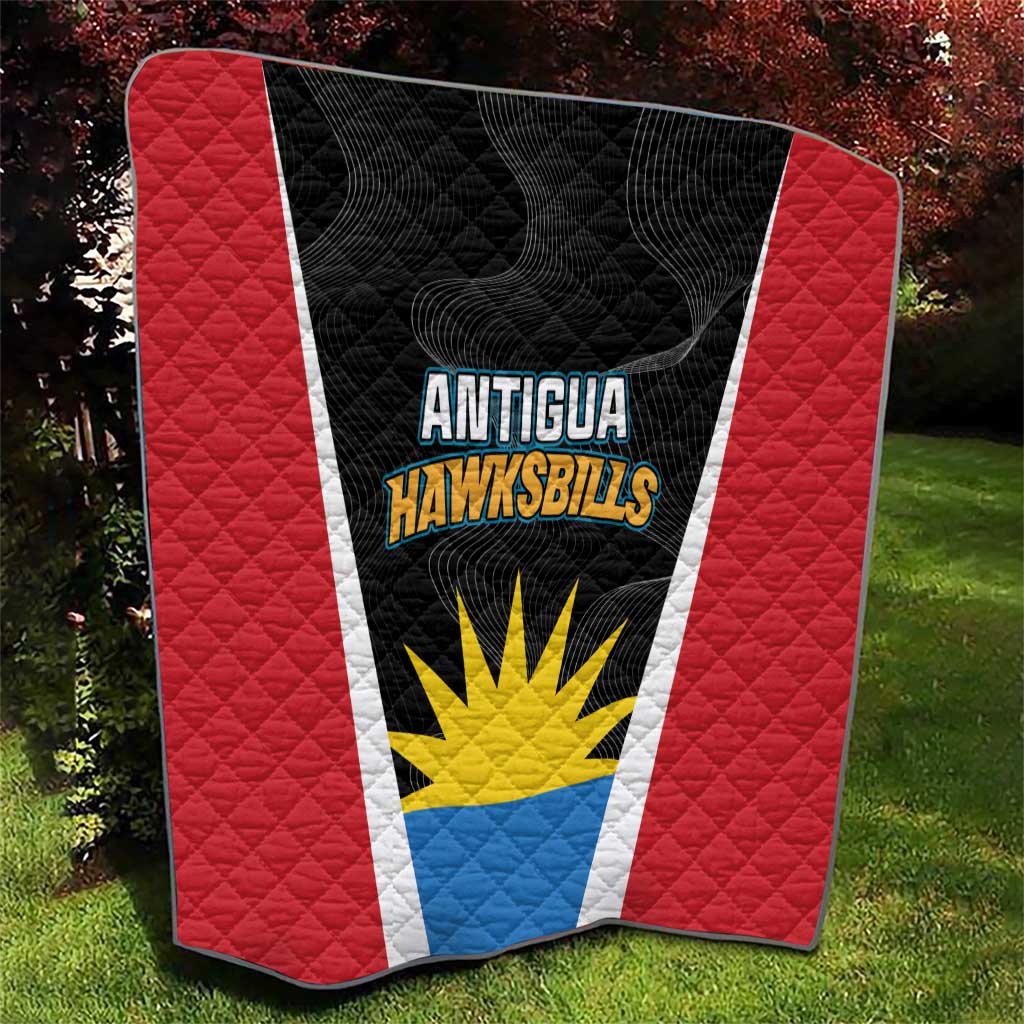 Red and black quilt with Antigua Hawksbills shield and sun emblem, quilted diagonal pattern