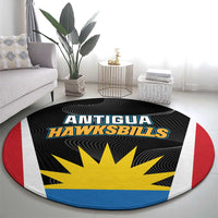 Round black carpet with Antigua Hawksbills text and yellow sunburst, concentric stripes