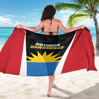 Antigua Hawksbills sarong draped by back, black/red/blue/white flag print with yellow sunburst