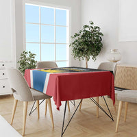 Team logo tablecloth with red, white, and blue panels draped over dining table
