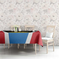 Dining tablecloth with red, blue, and white striped design plus black logo