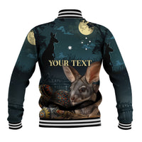 Back of Easter baseball jacket with bunny, stars, and text print, teal/black ribbed hem