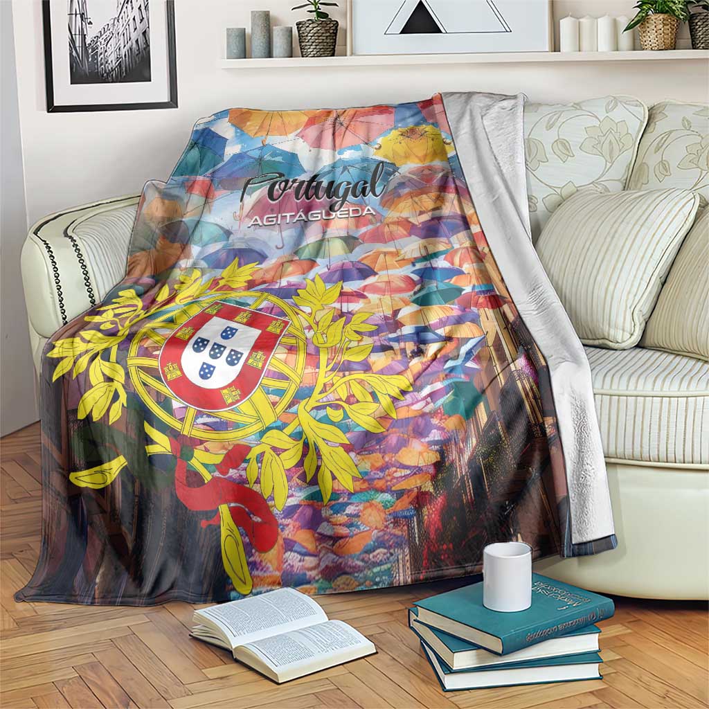 Colorful Portugal umbrella blanket with crest and floral motif, draped over sofa arm