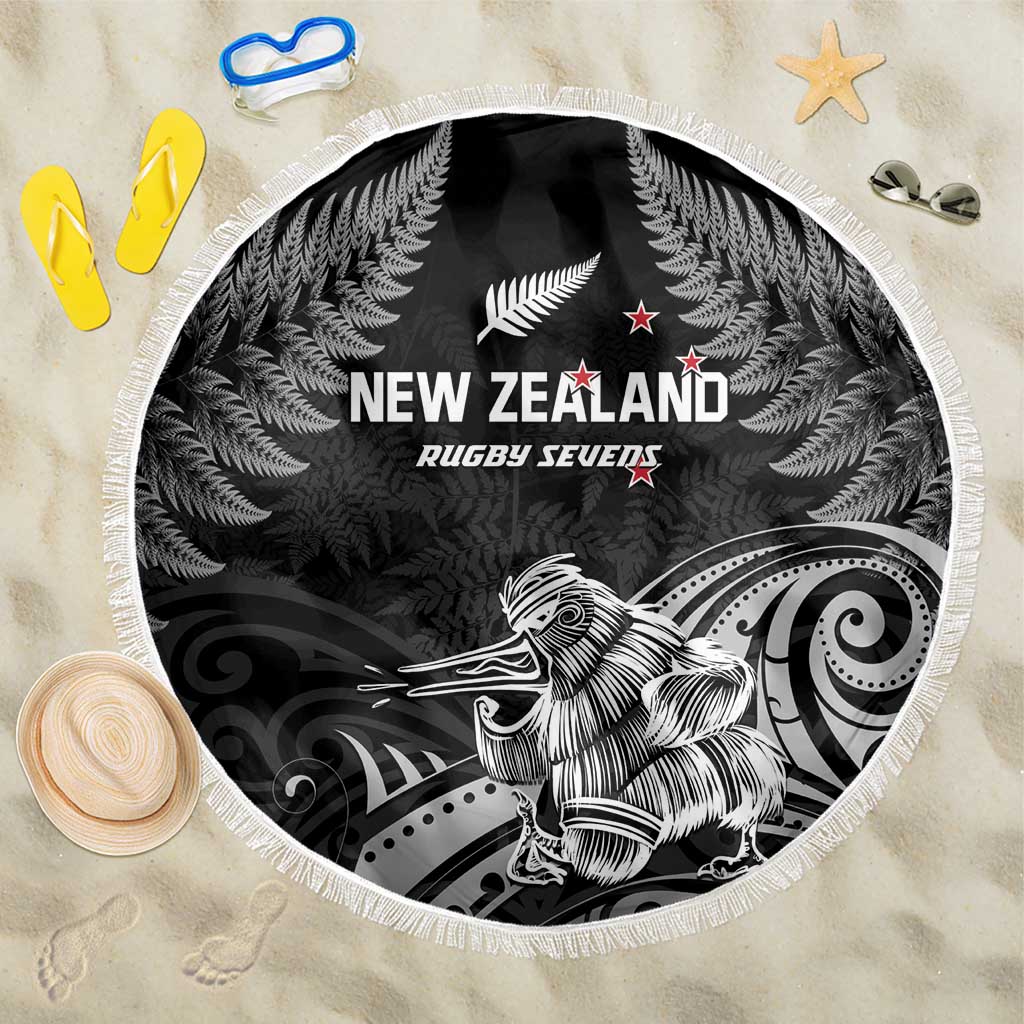 Black round beach blanket with fringe, New Zealand rugby graphic and fern leaves