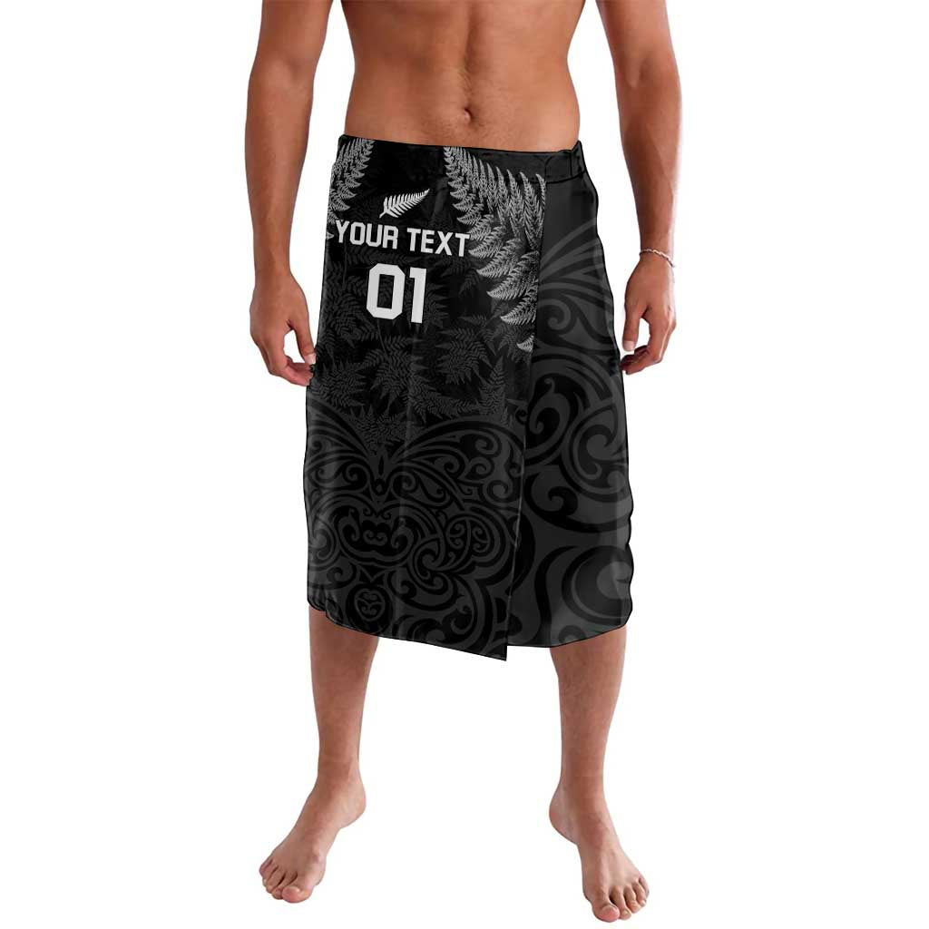 Black rugby lavalava shorts with fern and spiral print, elastic waistband, 'YOUR TEXT 01' front