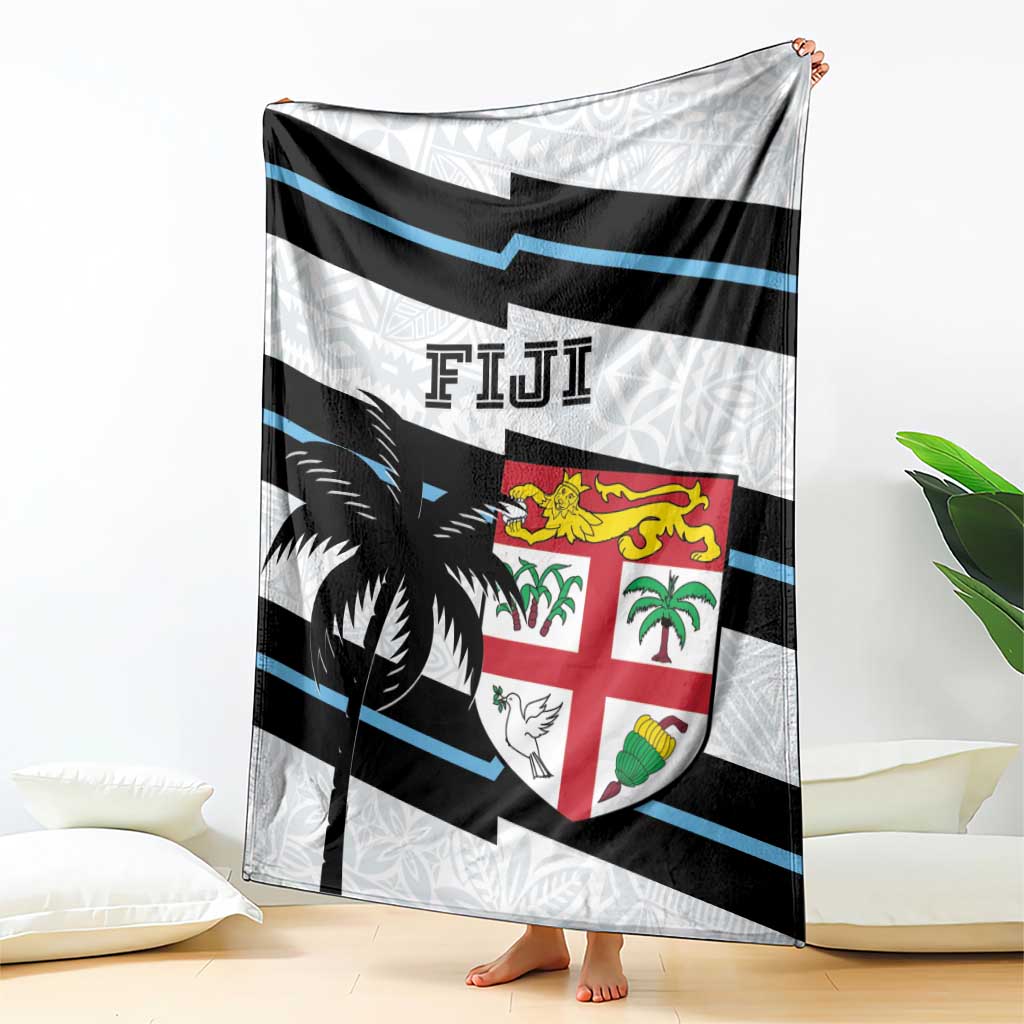 Fiji rugby blanket with large crest shield, black palm motif, and blue stripe bands