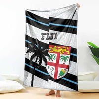 Fiji rugby blanket with large crest shield, black palm motif, and blue stripe bands