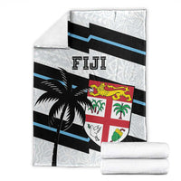 Fiji rugby blanket folded with blue stripe bands, black palm motif, and shield crest