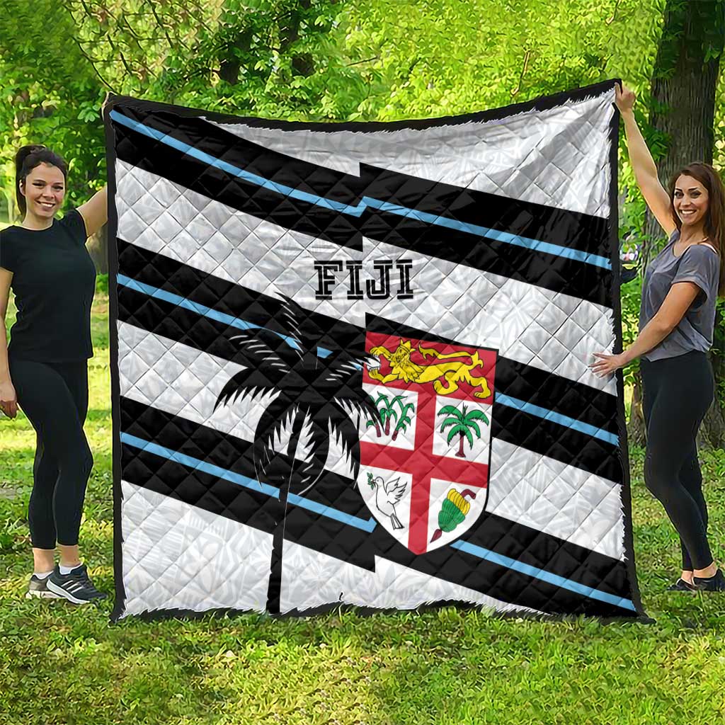 Rugby quilt draped display: white, black and blue stripes with palm tree and Fiji crest
