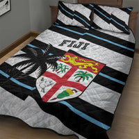 Fiji quilt bed set with quilted white, black and blue stripes, crest and palm leaves