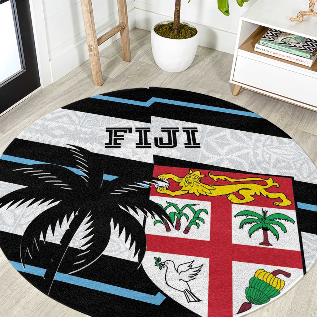 Round rugby carpet rug in black, blue, and white with tapa-style animal and palm motifs