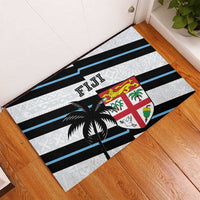 Rectangular doormat with FIJI lettering, palm tree, crest and blue/black stripes