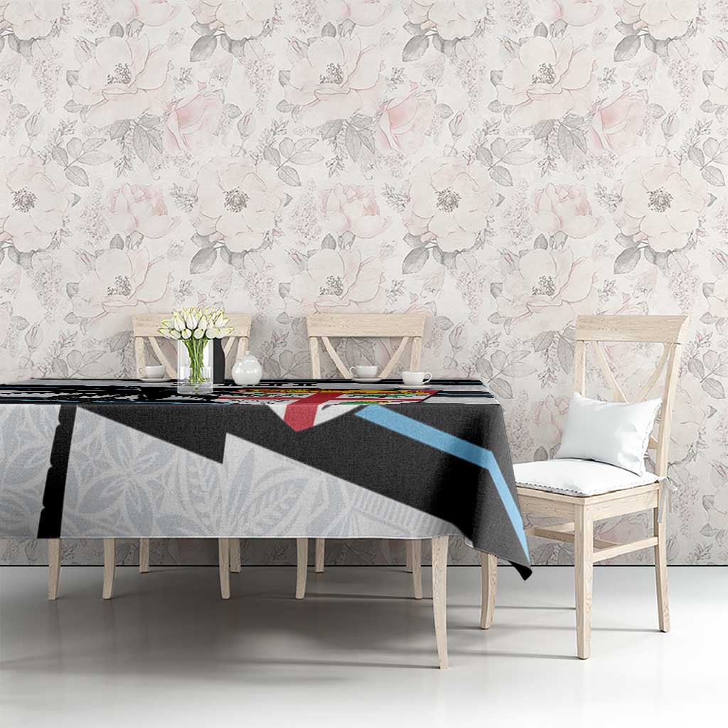 White rugby tablecloth with black and blue stripe band and tapa pattern, Fiji crest