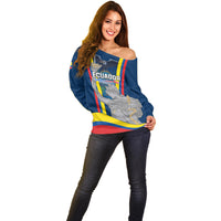 Women’s blue off-shoulder sweater with Ecuador-style crest print and flag stripe hem