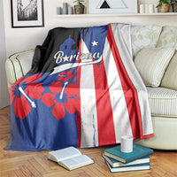 Puerto Rico flag-style fleece blanket on sofa with Boricua text, hibiscus flowers, and flag stripes