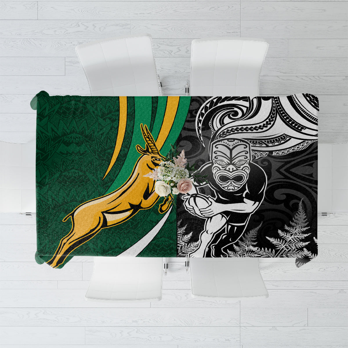 Green and black rugby tablecloth with silver fern, tiki-style face, and gold emblem