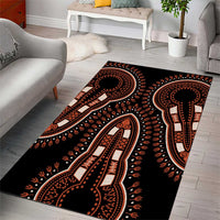 Black tribal area rug with orange and cream elephant silhouette medallions