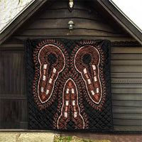 Black quilt wall-hanging with orange and white elephant silhouettes and diamond quilting