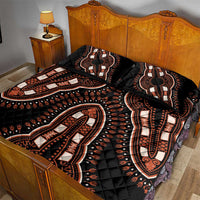 Black quilt bed set with orange and cream elephant designs on quilted top and shams