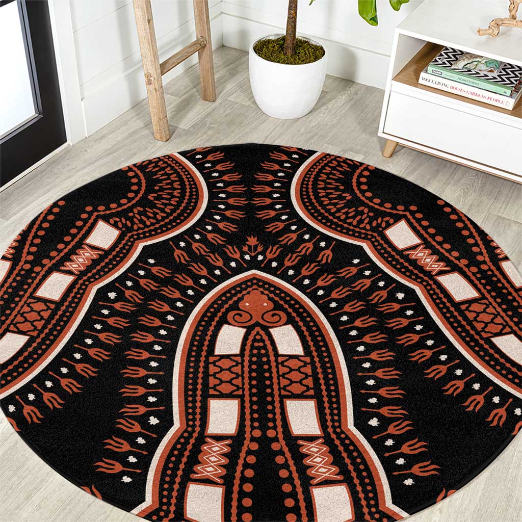 Round black area rug with orange tribal arch and dotted pattern, vintage medallion center