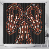 Black shower curtain with orange keyhole mask trio and ornate decorative border rays