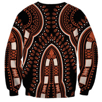 Black crewneck sweatshirt with orange central arch figure, patterned cuffs, and side medallions