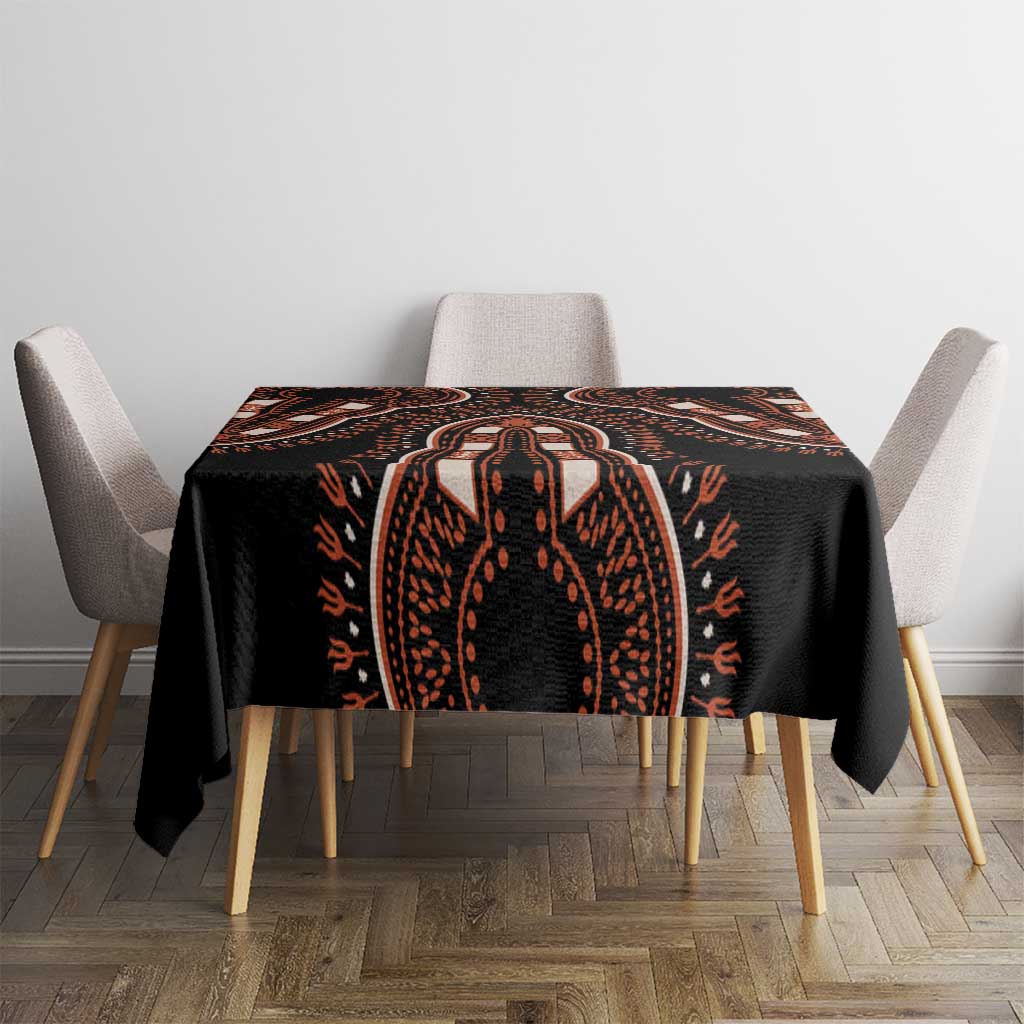 Black tablecloth with central orange dashiki motif, square top coverage