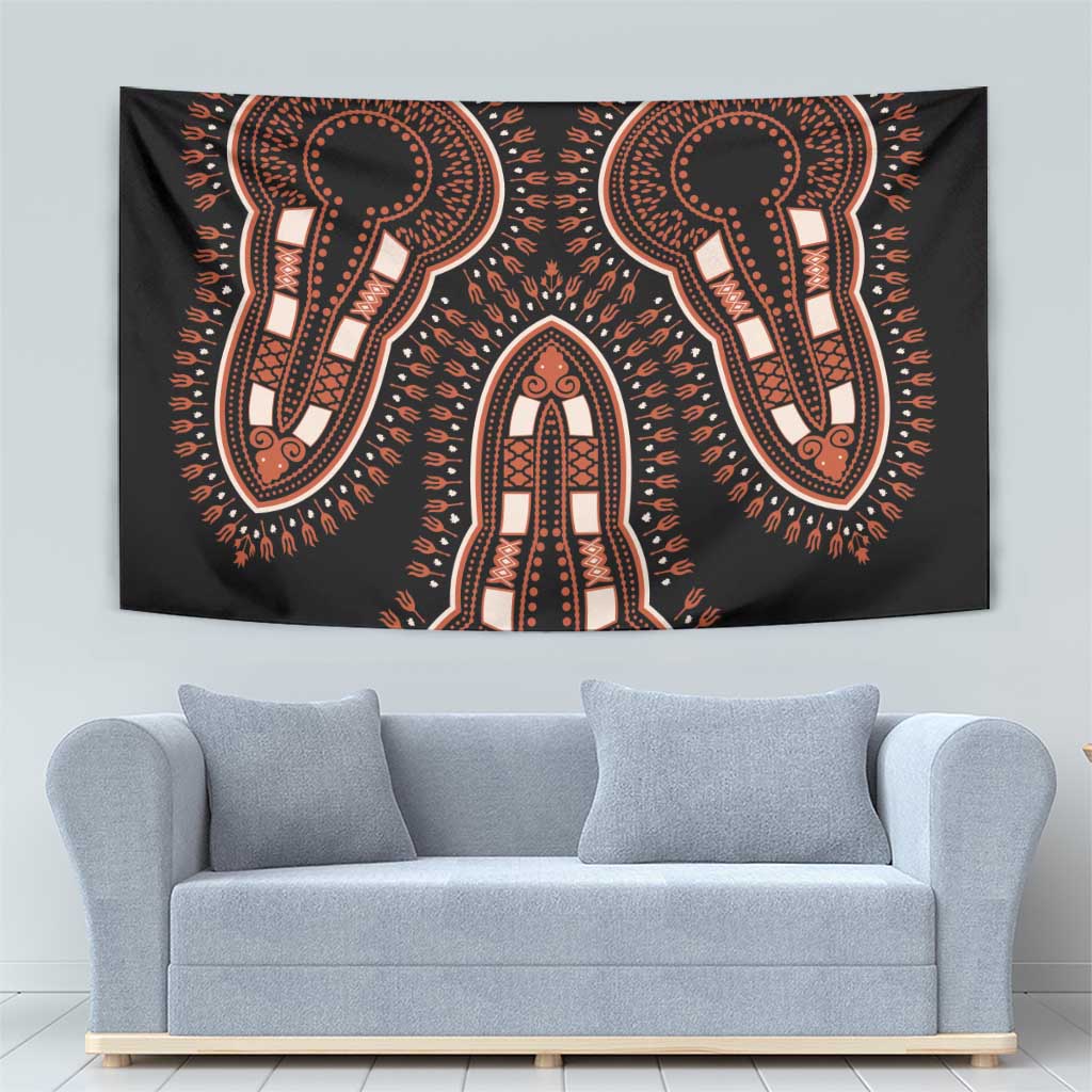 Black tapestry with orange and beige ornamental figures arranged around a central figure