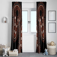 Black dashiki window curtain set with two panels showing orange medallion figure motifs.