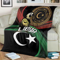 Black flag-themed blanket draped on couch with white crescent and star, green red stripes