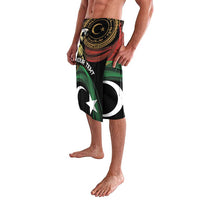 Black graphic lavalava shorts with wavy red and green stripes, crescent and star